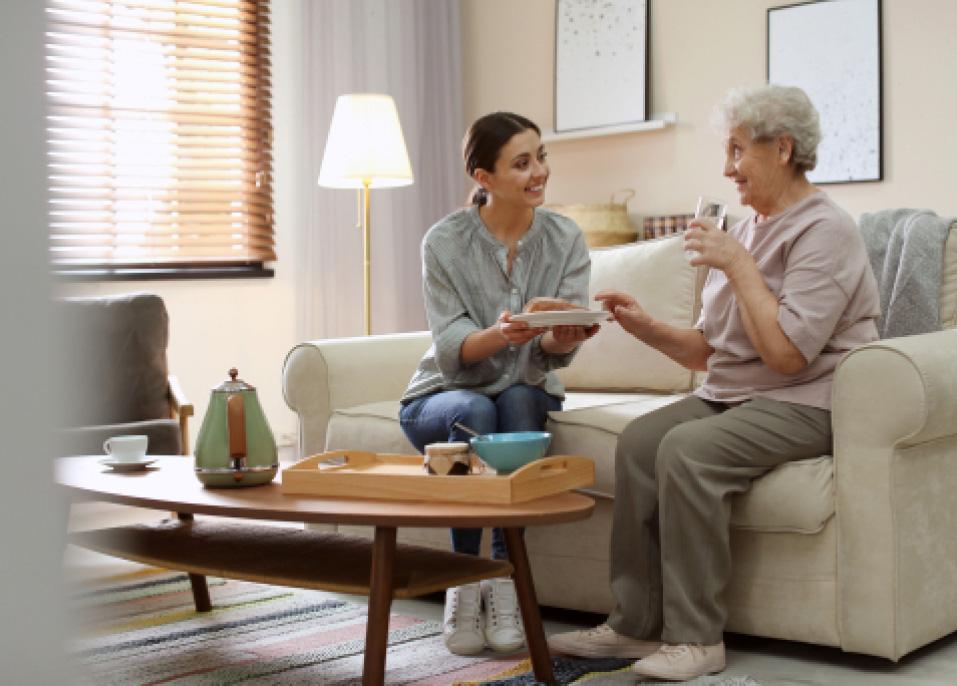 A young woman interacting with an older woman